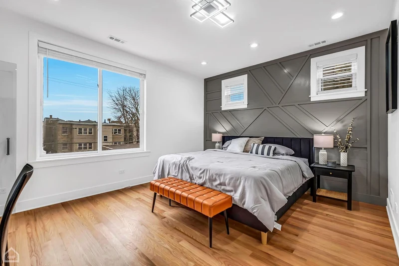 Guest bedroom with charcoal accent wall
