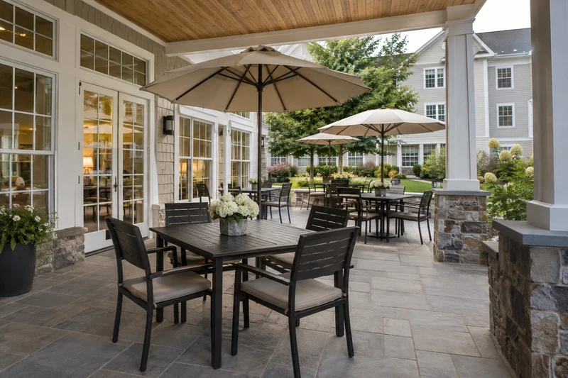 Shaded outdoor dining terrace with ordinary tables and umbrellas